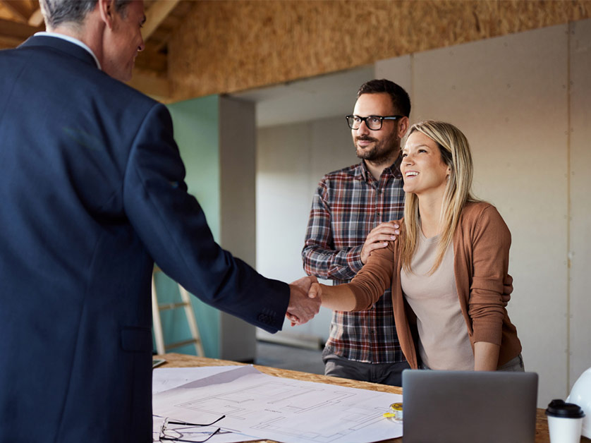 Handshake at a professional meeting table.