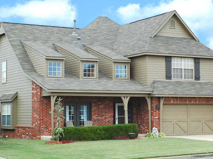 Modern two-story house with a garage.
